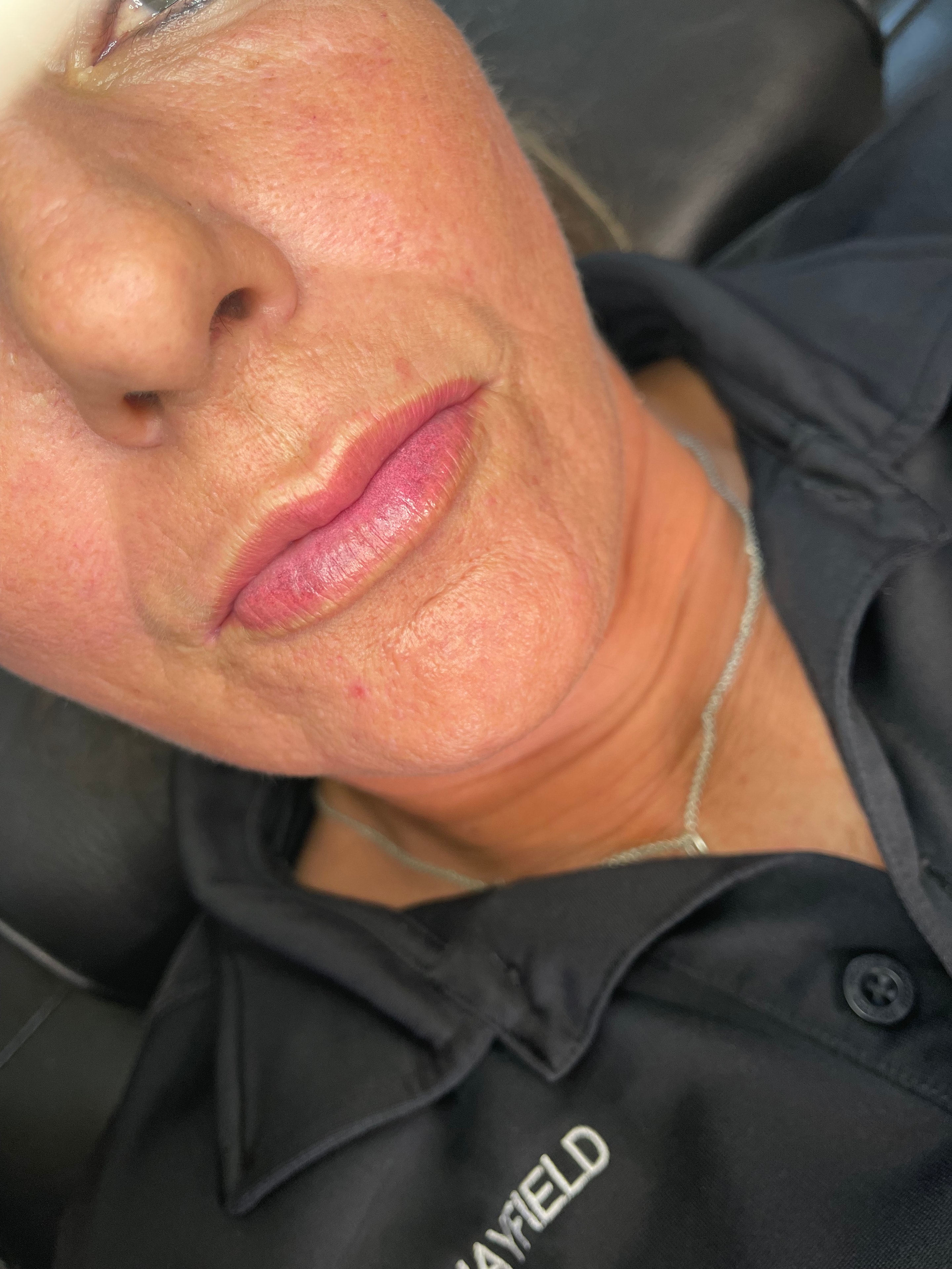 Fresh lip blush application — soft rose tone, even coverage.